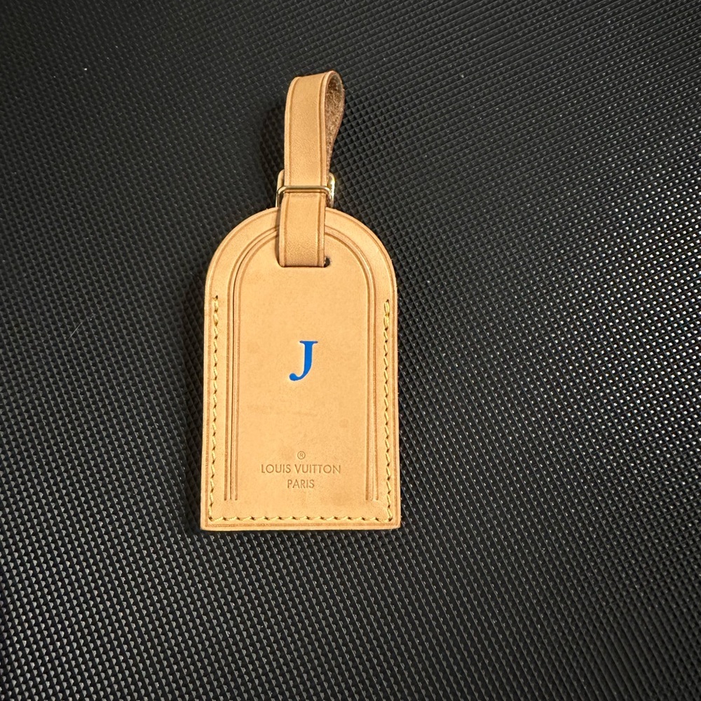 - LOUIS VUITTON “J” initials Luggage tag